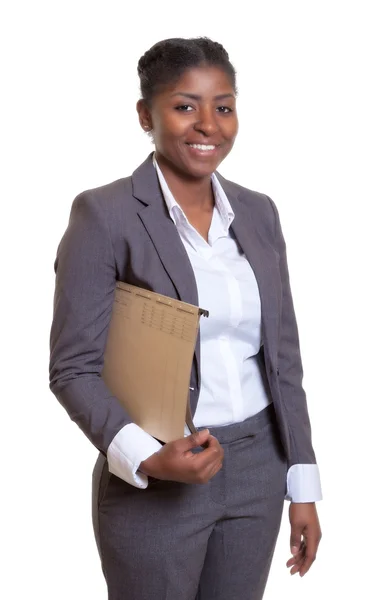 Laughing african business woman with file — Stock Photo, Image