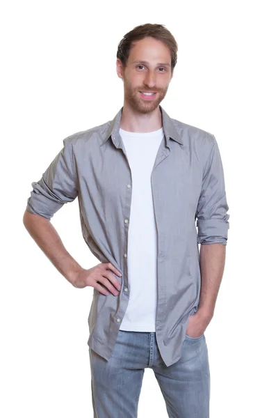 Bonito alemão de camisa cinza com barba em jeans — Fotografia de Stock