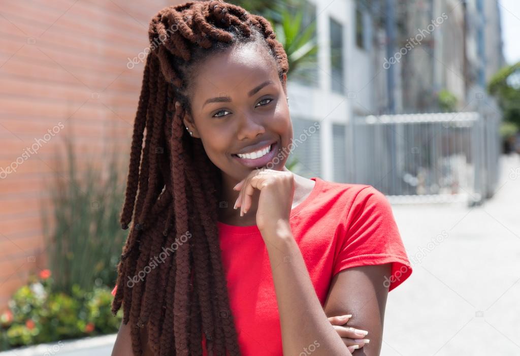 Beautiful african woman with dreadlocks in the city