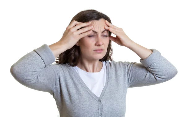 Kaukasische vrouw met donker haar heeft een migraine — Stockfoto