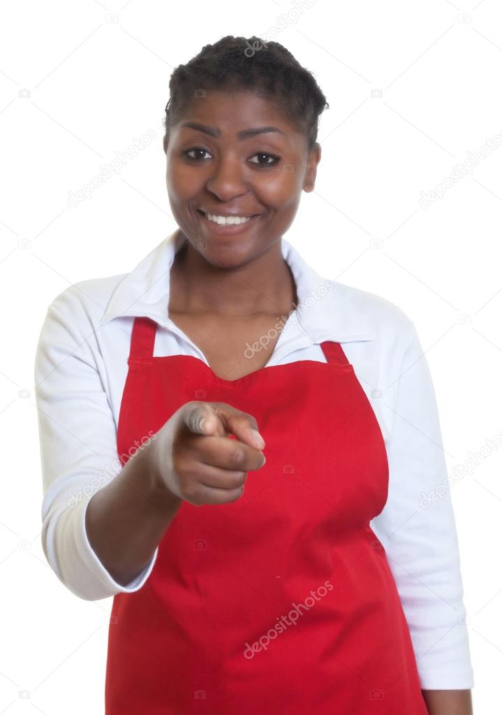 Laughing african american waitress pointing at camera