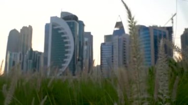 Doha, Qatar- 03 November 2020 :The skyline of Qatar city during sunset with gloomy sky . moving shot