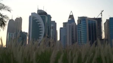 Doha, Qatar- 03 November 2020 :The skyline of Qatar city during sunset with gloomy sky . moving shot