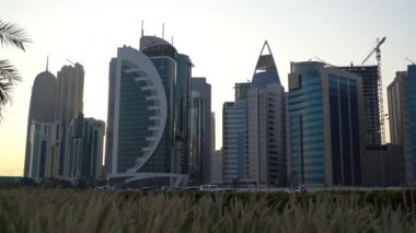 Doha, Qatar- 03 November 2020 :The skyline of Qatar city during sunset with gloomy sky . moving shot