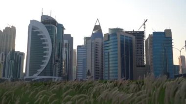 Doha, Qatar- 03 November 2020 :The skyline of Qatar city during sunset with gloomy sky . moving shot