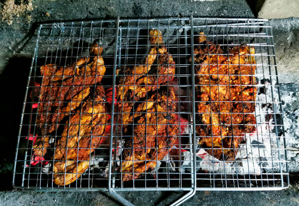 BBQ Grill Pit With Glowing And Flaming Hot Charcoal Briquettes, Food Background Or Texture, Close-Up, Top View