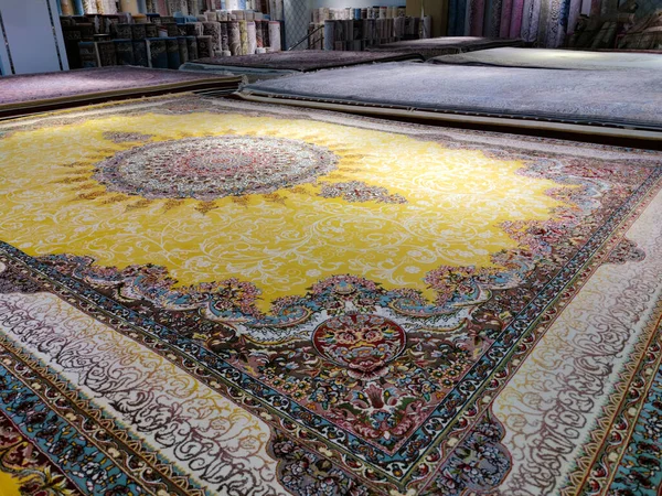 Multicolored persian carpets or rugs or floor mats at display ina shop