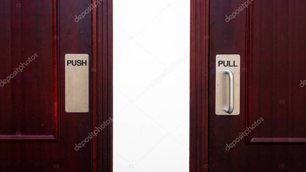 Push and pull sign on a door at a apartment.