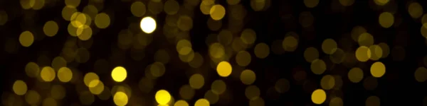 Обезглавленные Золотые Рождественские Огни Темном Фоне Желтые Боке Круги Черном — стоковое фото