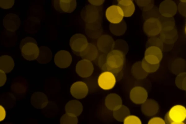 Desenfocado Luces Navidad Oro Sobre Fondo Oscuro Círculos Bokeh Amarillo — Foto de Stock