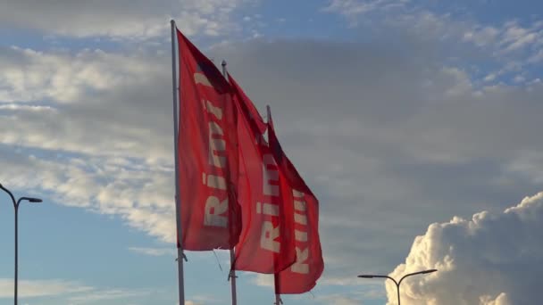 Estonia, Tallinn 23.12.2020: Rimi hypermarket flag on windy day — Stock Video