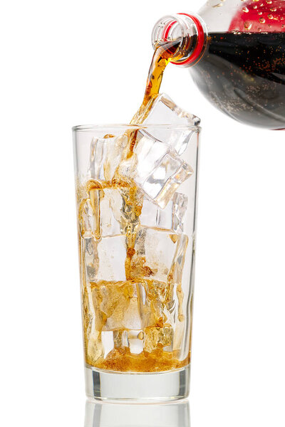 Pouring Cola to glass with ice cubes isolated on white, copy space
