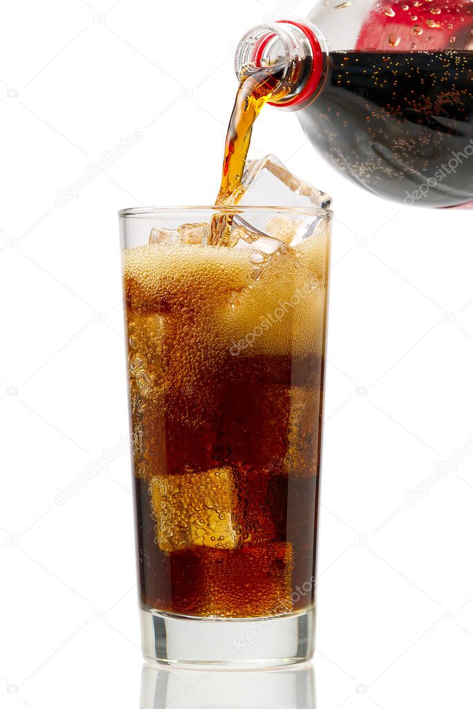 Pouring Cola to glass with ice cubes isolated on white