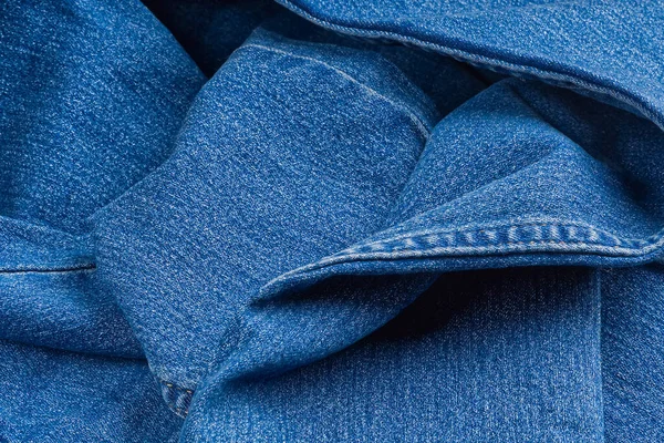 Nuovo tessuto blue jeans. jeans macro texture sfondo. — Foto Stock