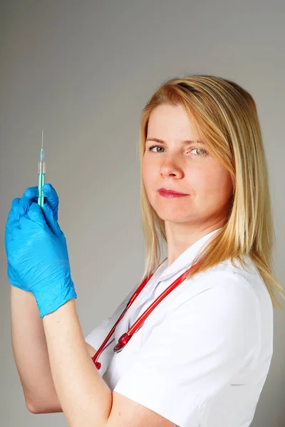 nurse holding vaccine and syringe, vaccination against the virus covid-19
