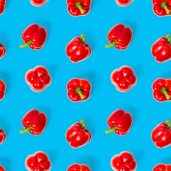 Seamless pattern of bulgarian red pepper on blue background. wallpaper, print pattern, top view, flat layout, isolated — Stock Photo, Image