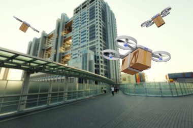 İHA şehirde bir teslimat kutusuyla uçuyor.