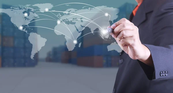 Business man mark point on world map concept exports to the world, Business success strategy plan on container yard background (Elementi di questa immagine forniti dalla NASA ) — Foto Stock