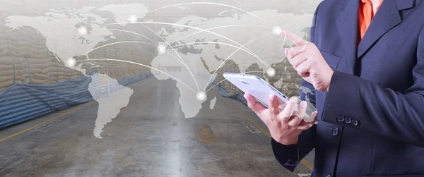 Hand presses on world map with digital tablet,export and import — Stock Photo, Image