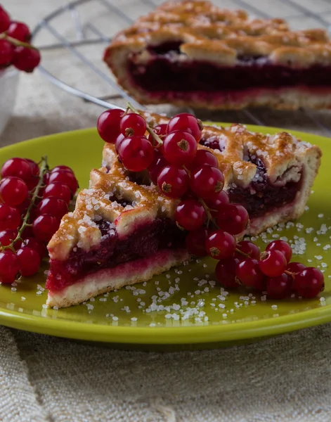 Cherry pie on green plate — Stock Fotó