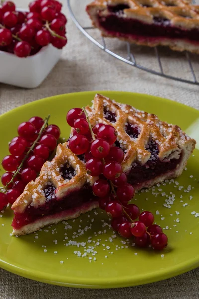 Cherry pie on green plate — Stock Fotó