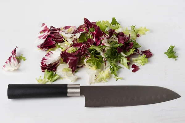 Chopped lettuce with knife — Stock Photo, Image