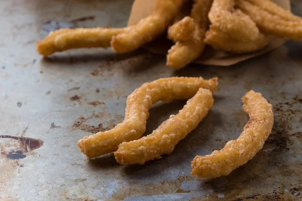 Churros su lamiera d'acciaio — Foto Stock