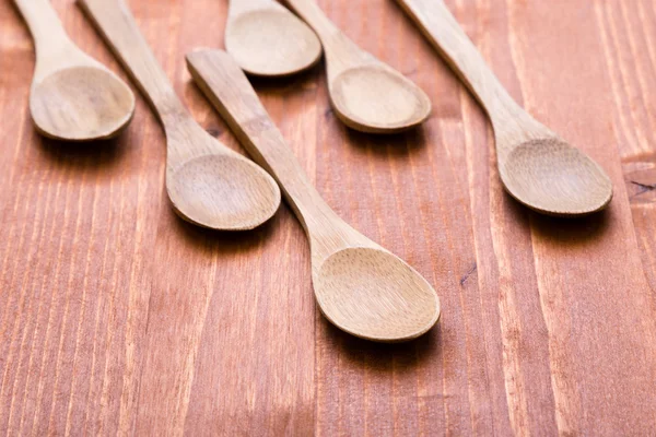 Wooden spoons on wooden table — Stock Photo, Image