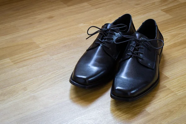 Black shoes on the floor — Stock Photo, Image