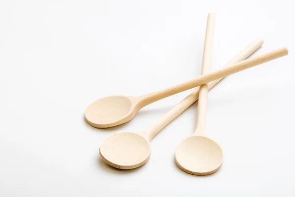 Wooden spoons on white table — Stock Photo, Image