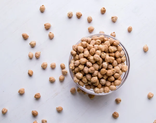 Chickpeas on white table — Stock Photo, Image