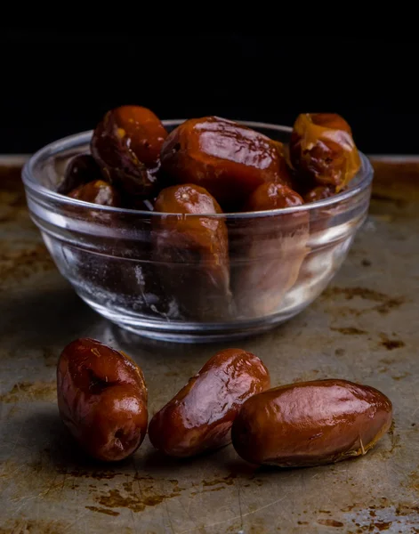 Dried dates on steel plate — Stock Photo, Image