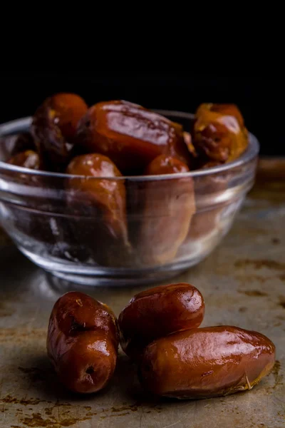 Dried dates on steel plate — Stock Photo, Image