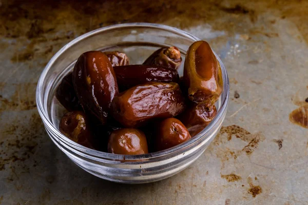 Dried dates on steel plate — Stock Photo, Image