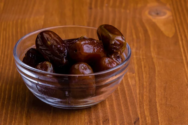 Dried dates on wooden table — Stock Photo, Image