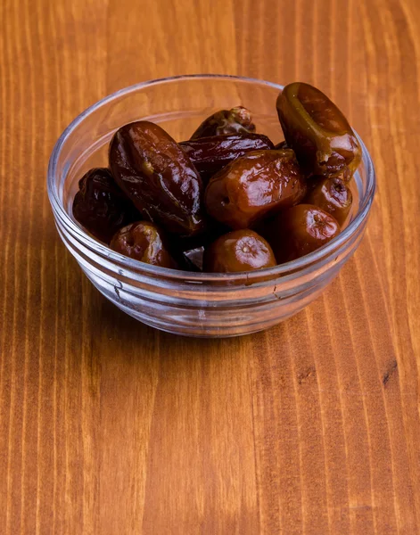 Dried dates on wooden table — Stock Photo, Image