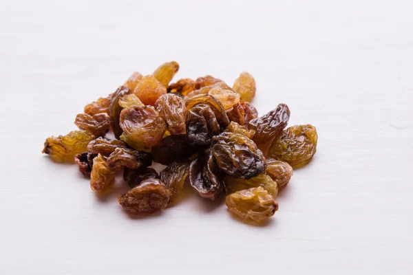 Raisins on white table — Stock Photo, Image