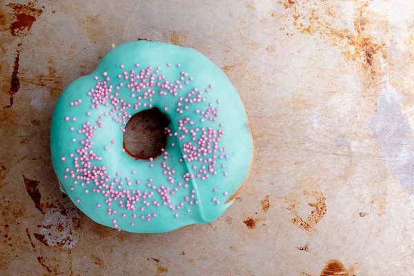 Donut with turquoise frosting — Stock Photo, Image