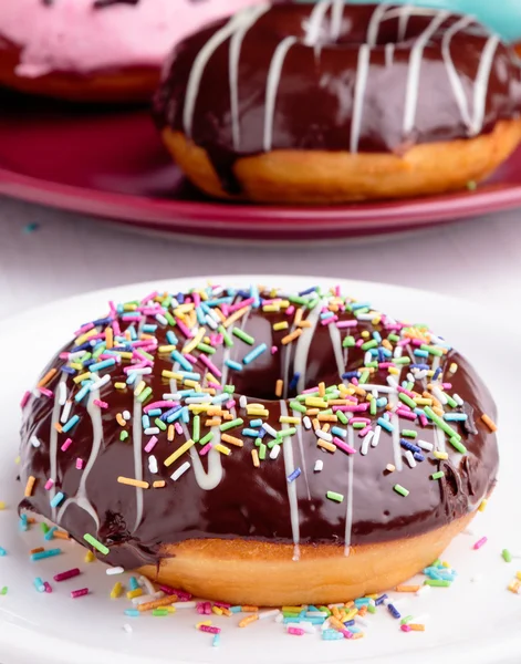 Chocolate donut with sprinkles — Stock Photo, Image