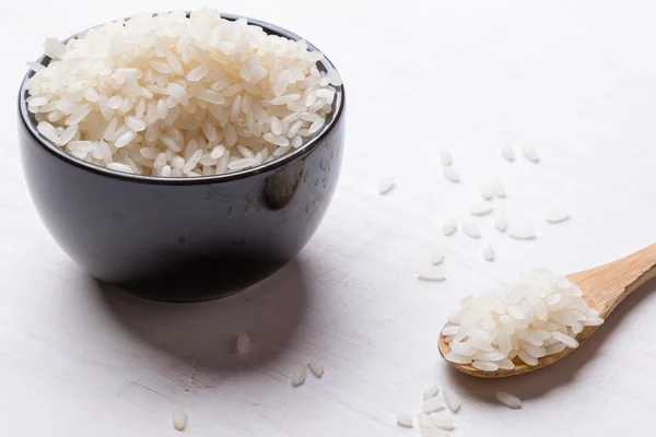 Rice in black bowl — Stock Photo, Image