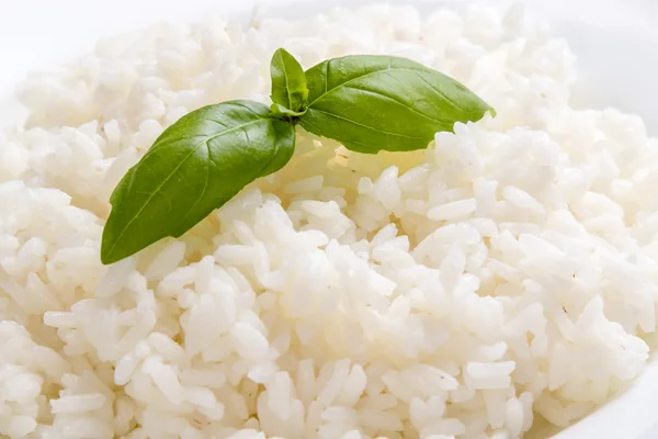Cooked rice with basil — Stock Photo, Image