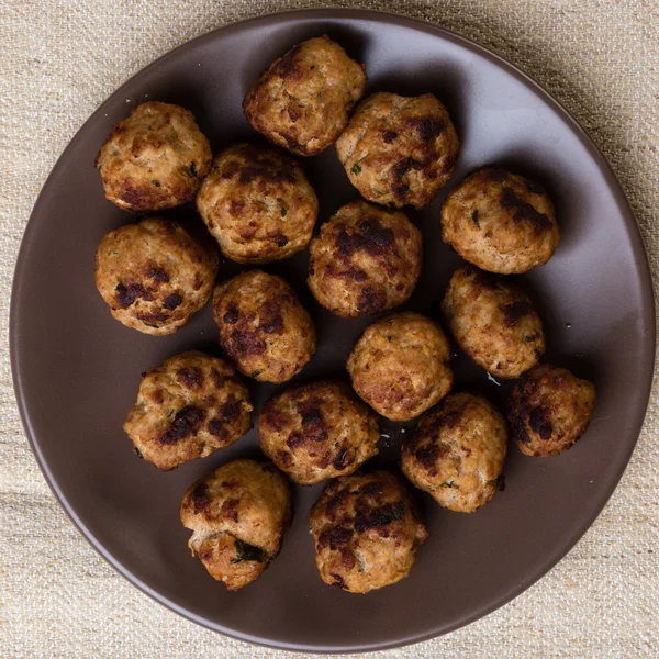 Meatballs on brown plate — Stock Photo, Image