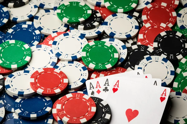 Four of a kind poker hand Aces and chips — Stock Photo, Image