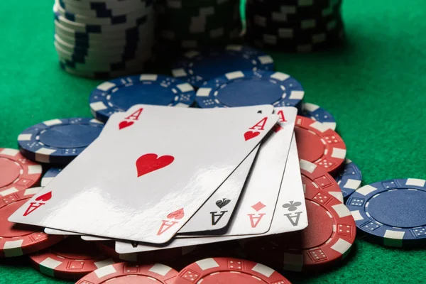 Four aces on poker chips — Stock Photo, Image