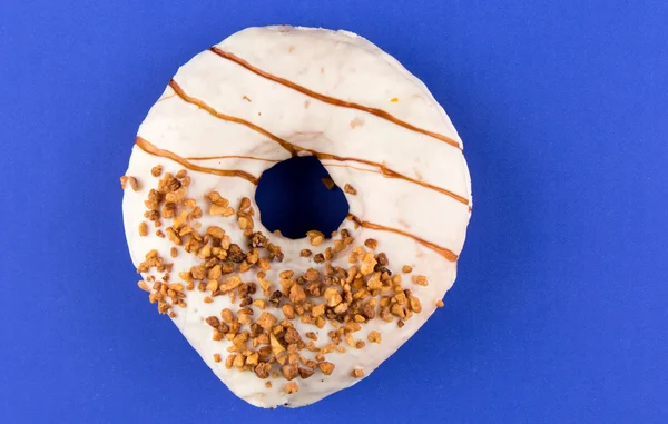 Doughnut on blue table — Stock Photo, Image