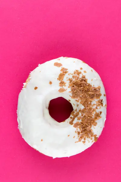 Doughnut on pink table — Stock Photo, Image