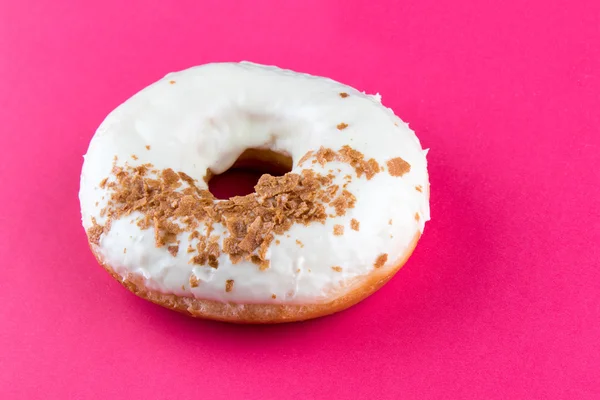 Doughnut on pink table — Stock Photo, Image