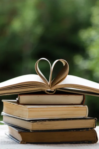 Stack of books with heart shape — Stock Photo, Image