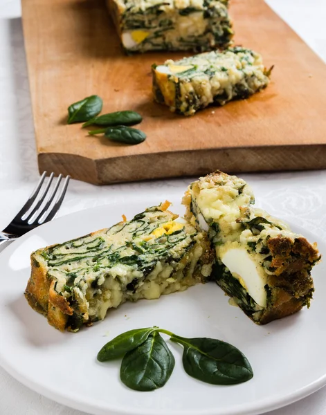 Spinach souffle on white plate — Stock Photo, Image