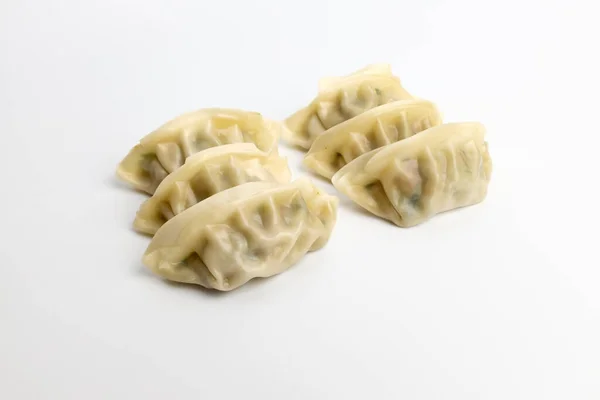 Domuz eti ve sebzeli börek. Buharda kızartılmış hamur köftesi.